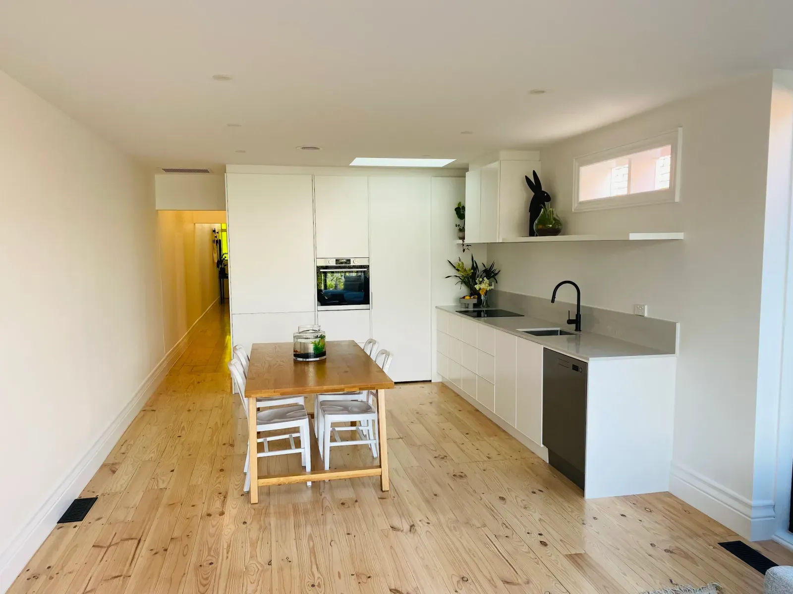 long galley kitchen opening onto the dining area
